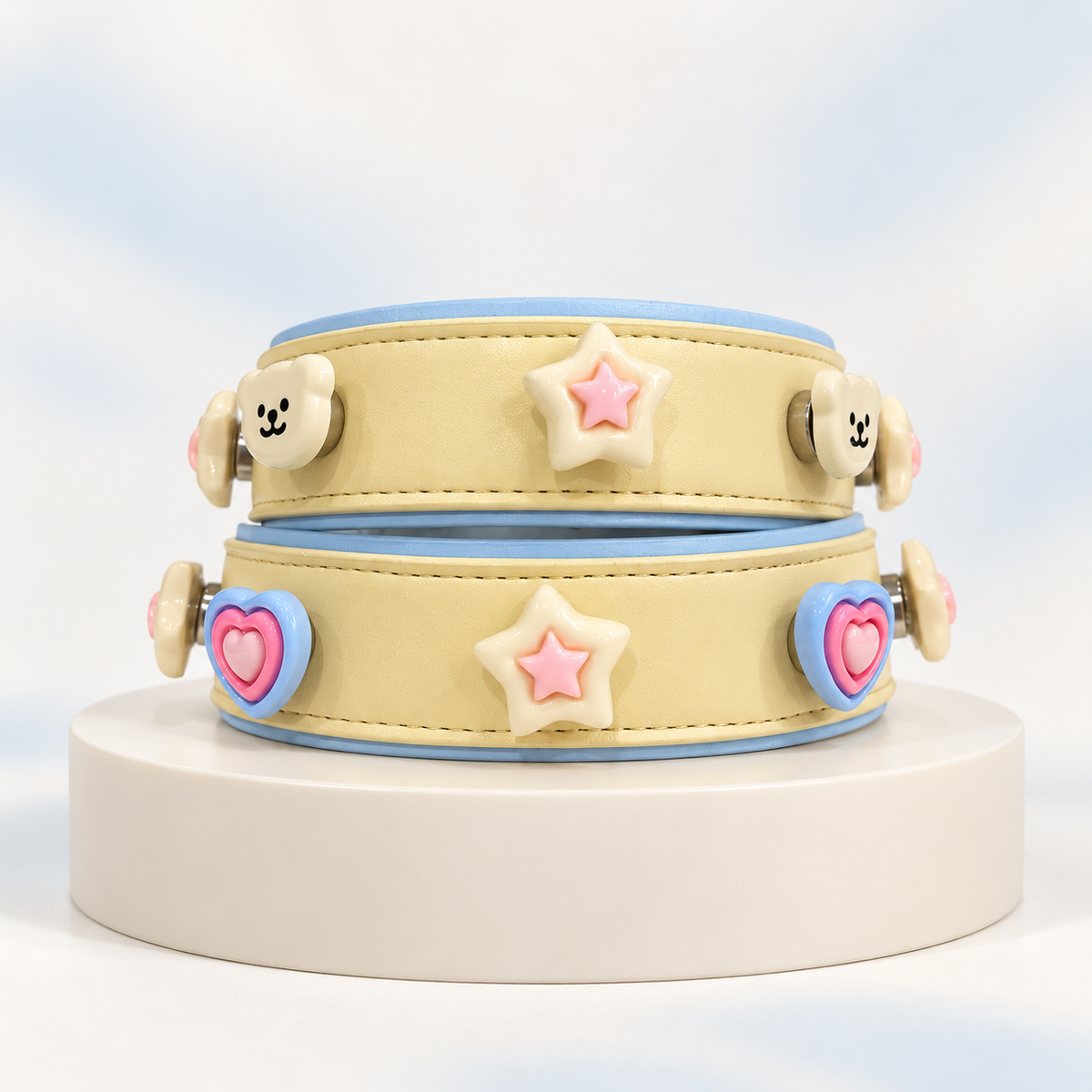 Pastel star and heart dog collar charms styled on cream Petiria interchangeable collars