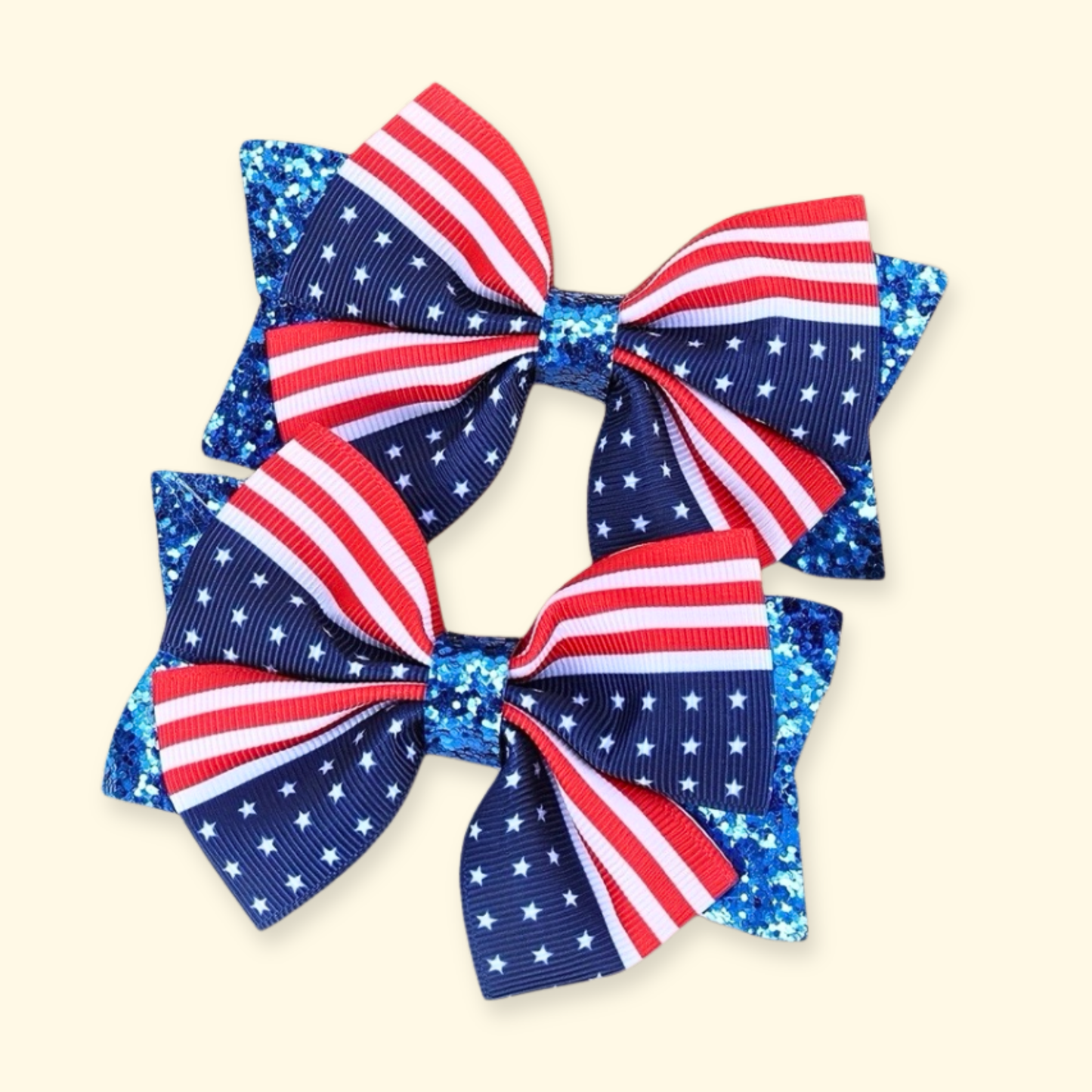 Red white and blue patriotic dog hair bow clip with stars and stripes design for small dogs