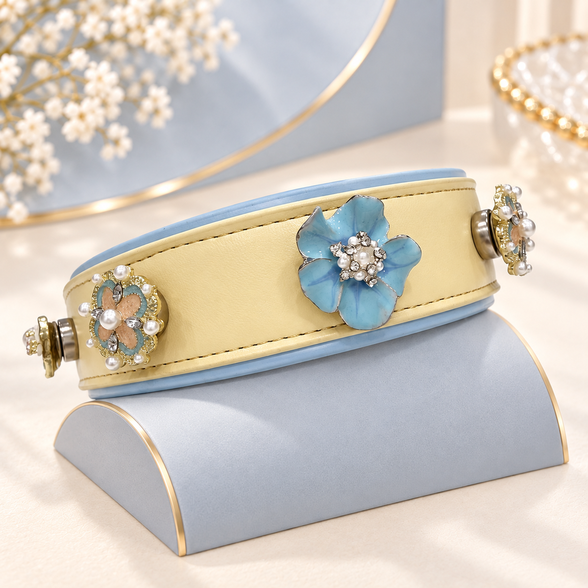 Yellow dog collar styled with interchangeable pearl and blue flower charms