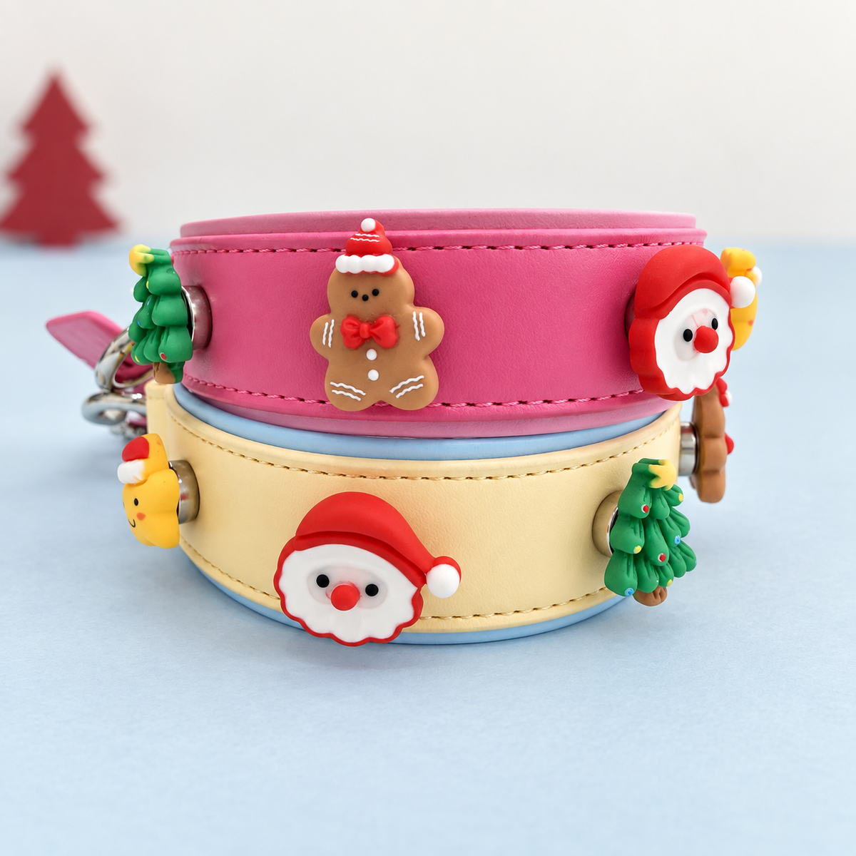 Pink and cream Petiria collars styled with interchangeable Santa, gingerbread, Christmas tree, star and gift charms