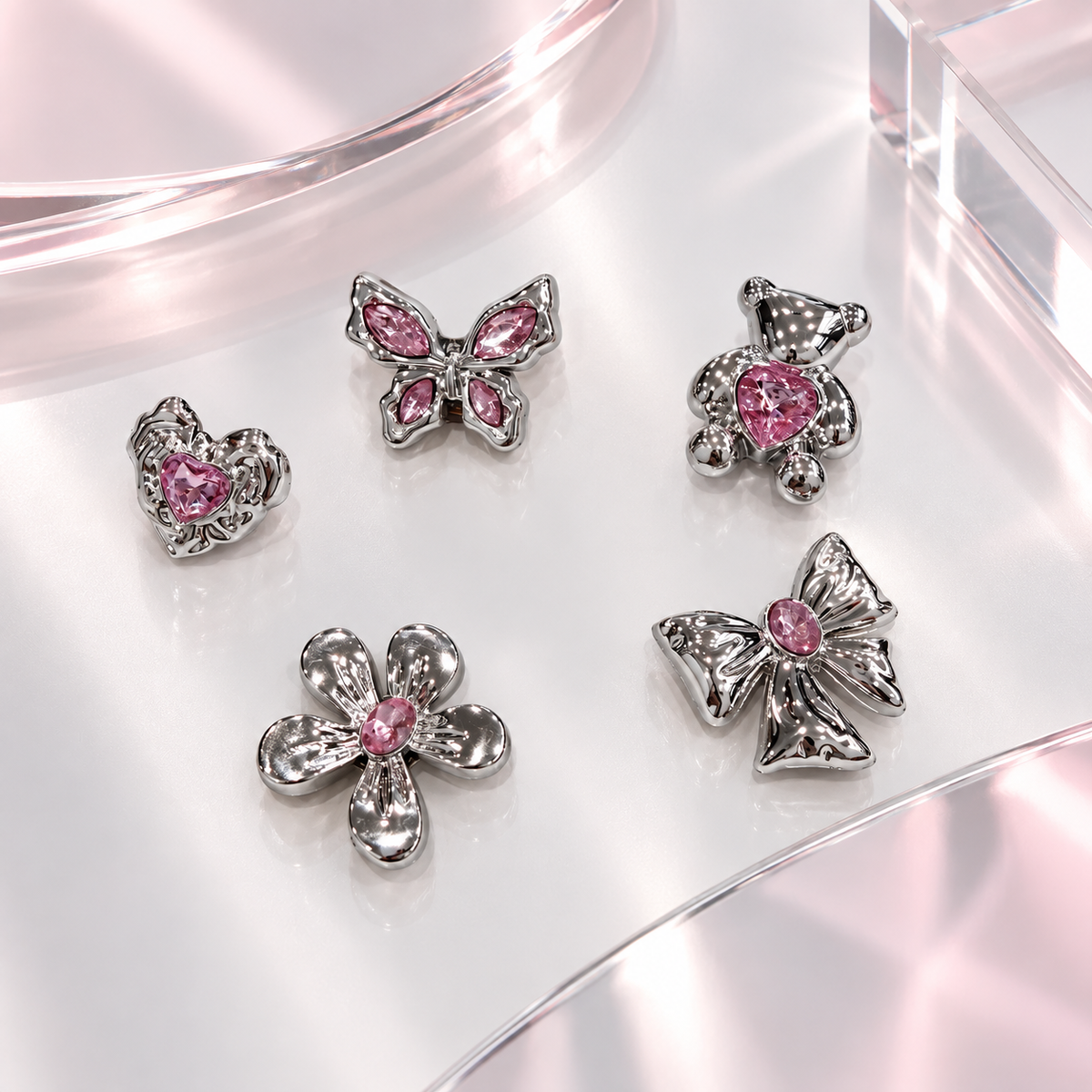 Pink crystal dog collar charm collection featuring flower, heart, bow, butterfly and teddy designs