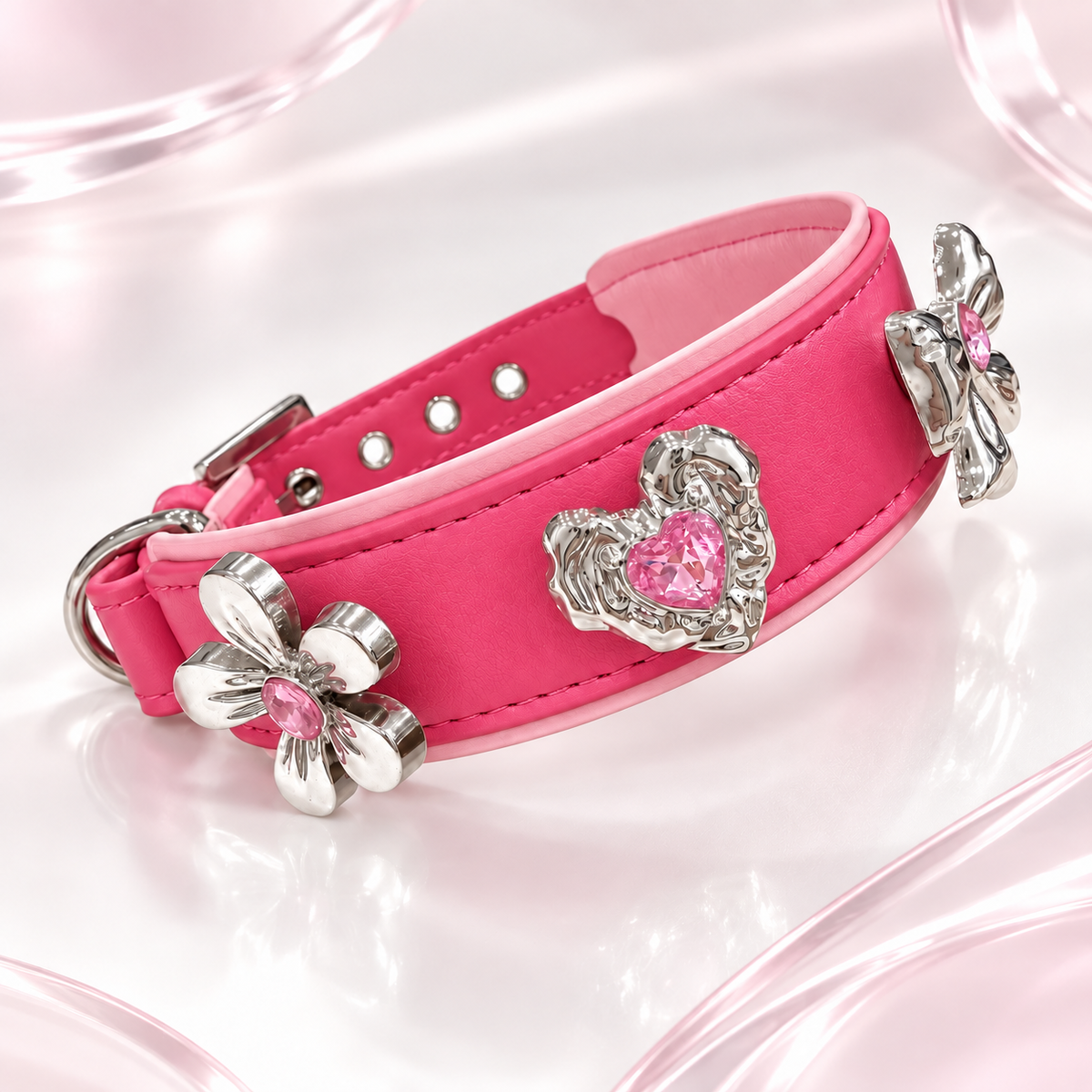 Pink PETIRIA collar styled with pink crystal dog collar charms featuring flower, heart and bow designs