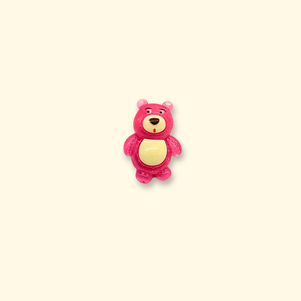 Pink teddy bear dog collar charm with a cream-colored belly