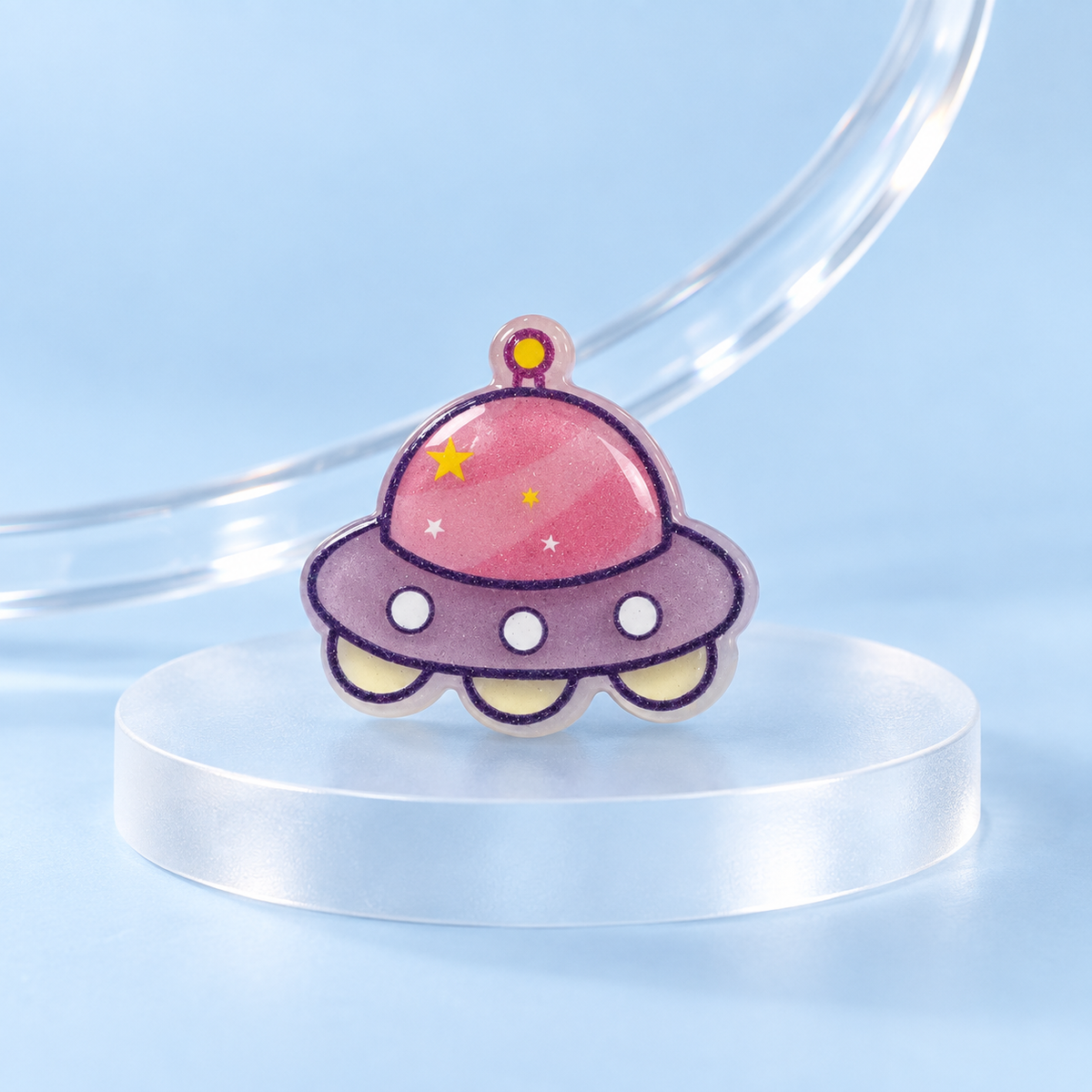 Pink UFO dog collar charm with purple and pink details in a cute cartoon space design