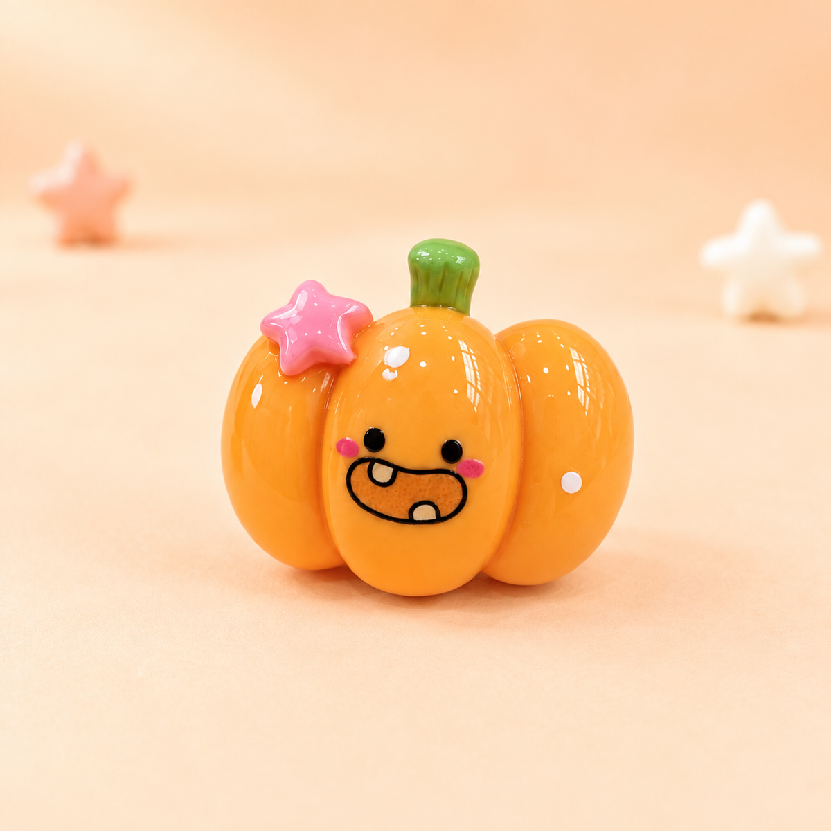 Cute orange pumpkin dog collar charm with a playful face and pink star for Halloween