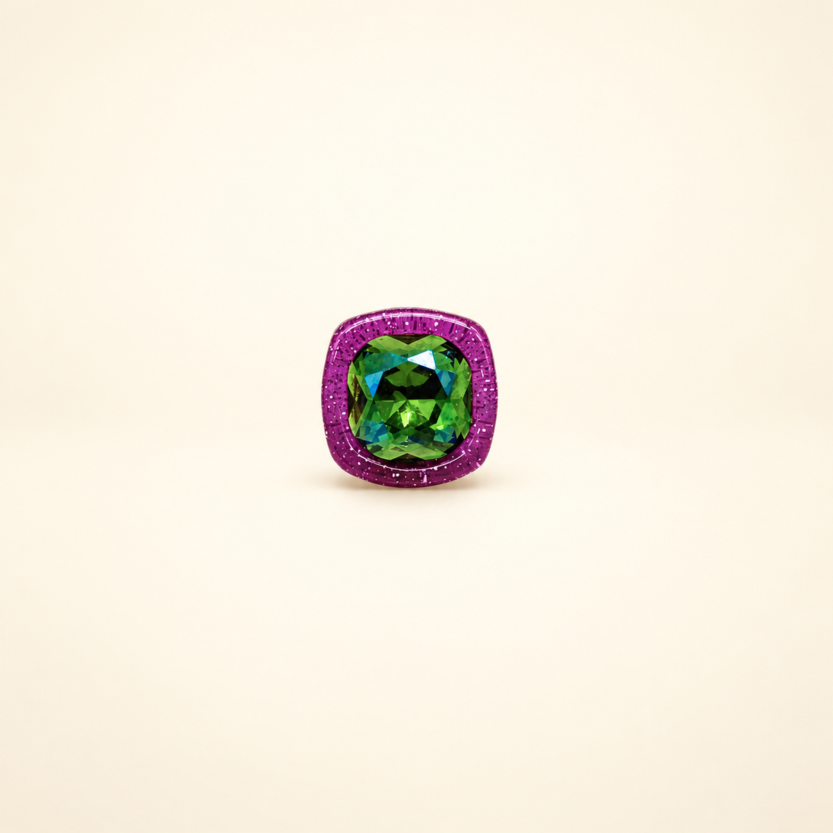 Purple-frame dog collar charm with a faceted green gem center and colorful crystal-inspired finish