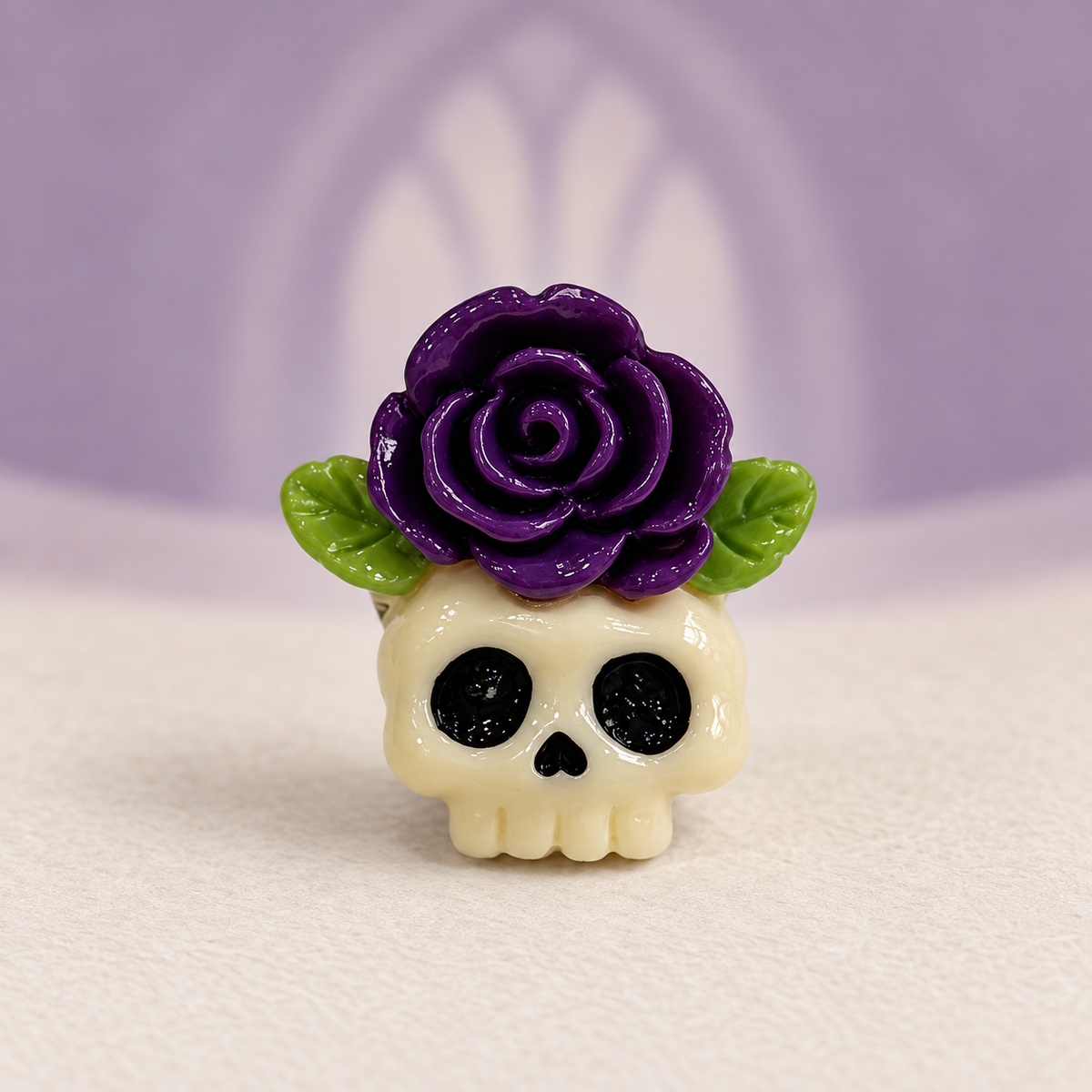 Skull dog collar charm topped with a purple rose and green leaves for a dark gothic Halloween look