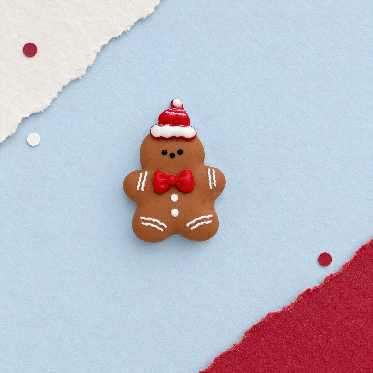Gingerbread man dog collar charm wearing a red Santa hat and bow for a cute personalized Christmas dog collar look