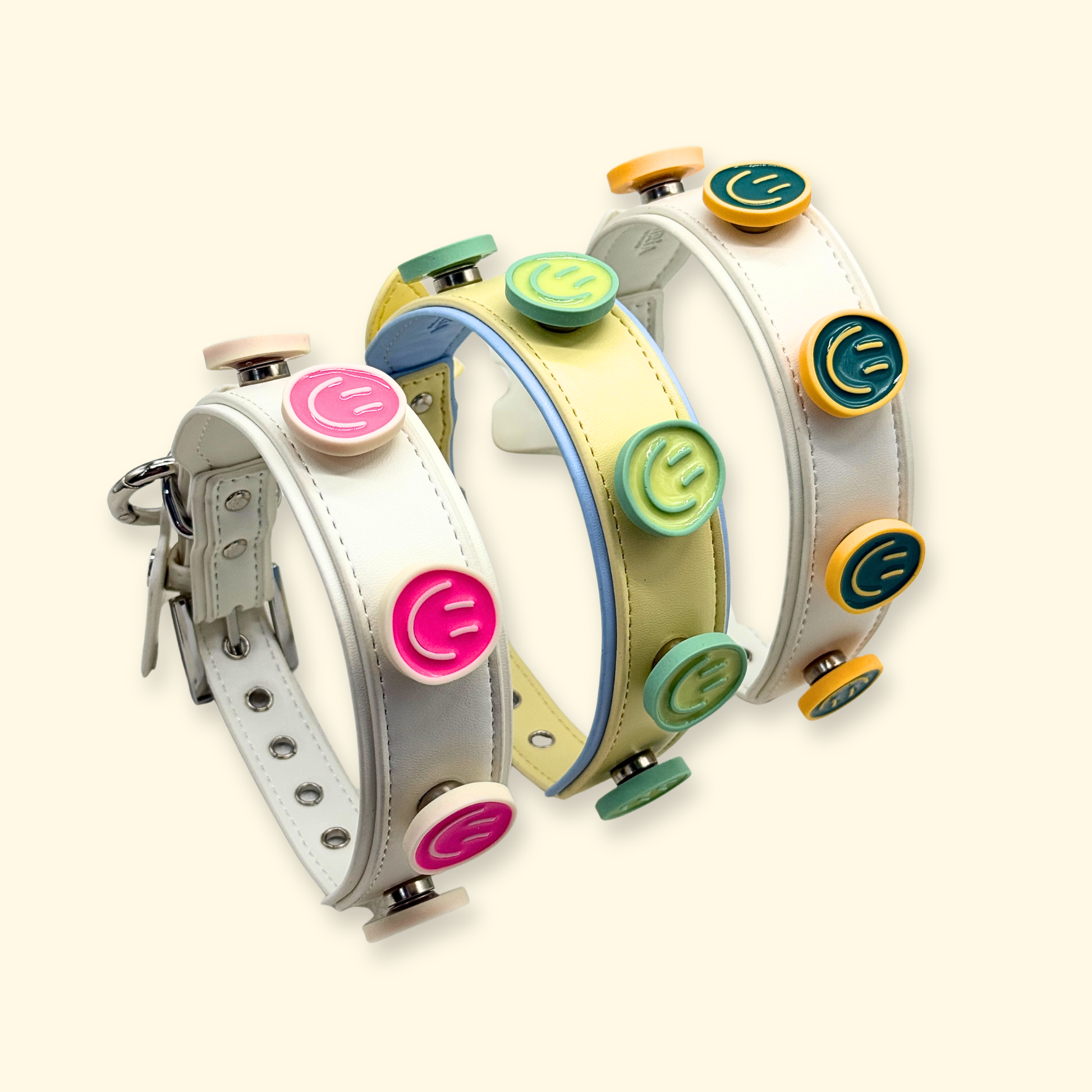 Colorful smiley snap-on dog collar charms on PETIRIA interchangeable collars. Multi-color pet accessories designed for dog collar customization in the United States pet fashion market.