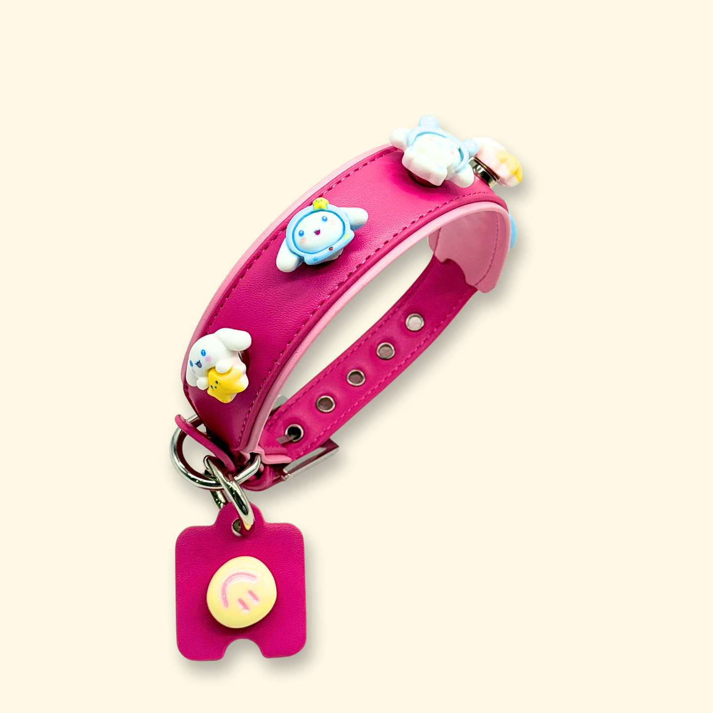 Adorable pet collar charms featuring smiling bunny faces in blue and yellow, perfect for a cute pet accessory look