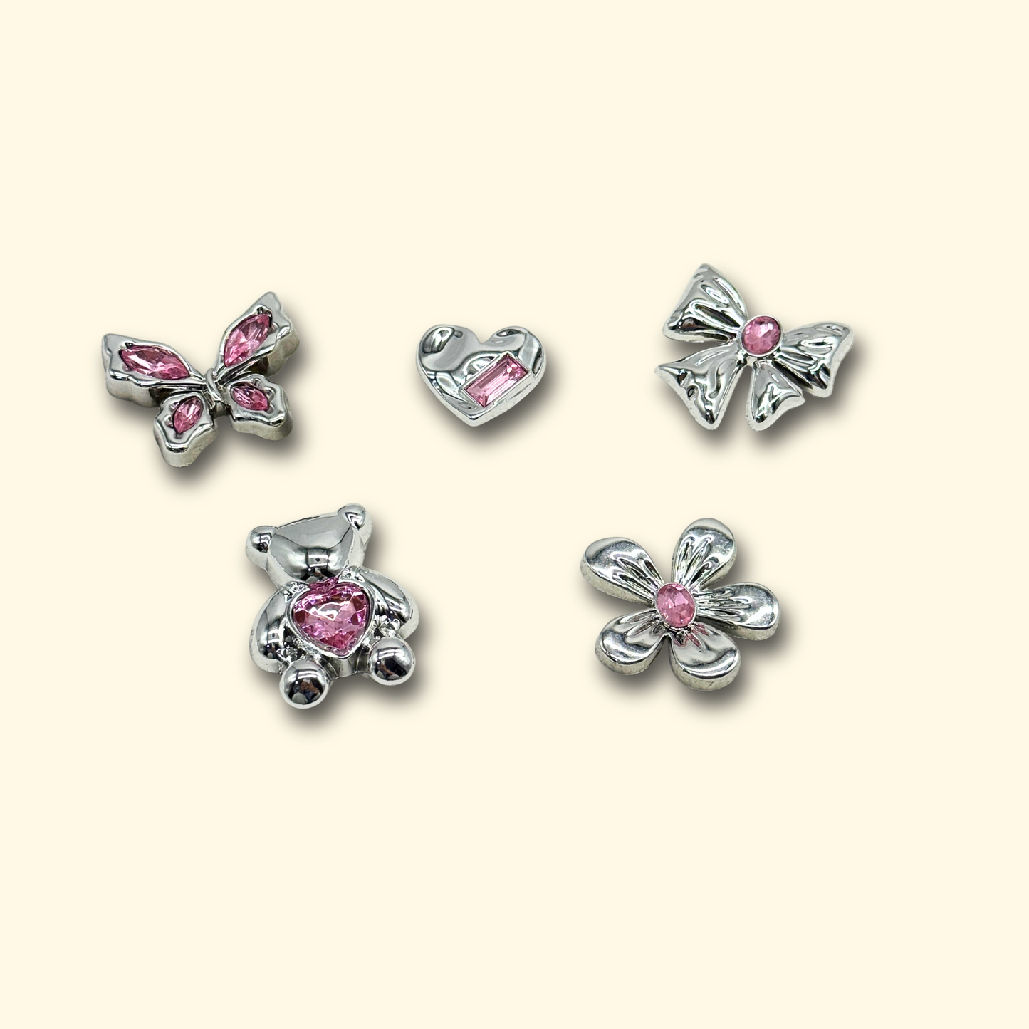 Set of 5 sparkling pink crystal pet charms including butterfly, heart, bow, teddy bear, and flower designs