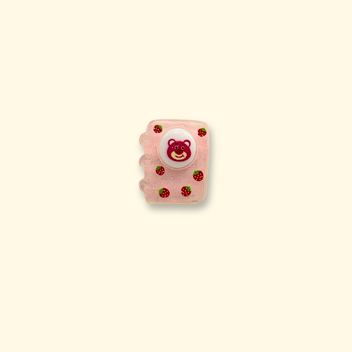 Pink strawberry-themed book dog collar charm with a cute bear illustration and strawberry details