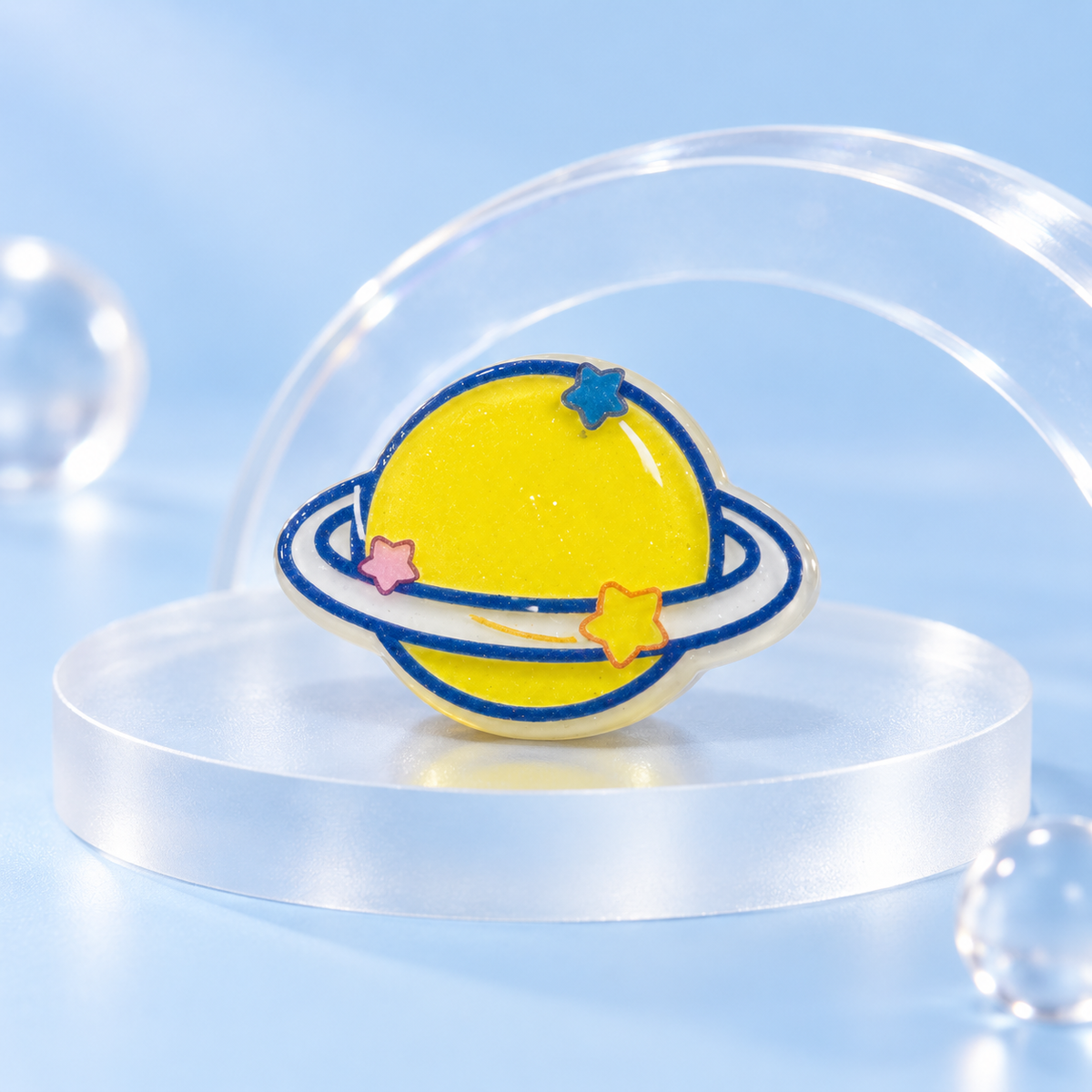 Sunny Saturn dog collar charm with a yellow planet, blue rings and playful space-inspired details