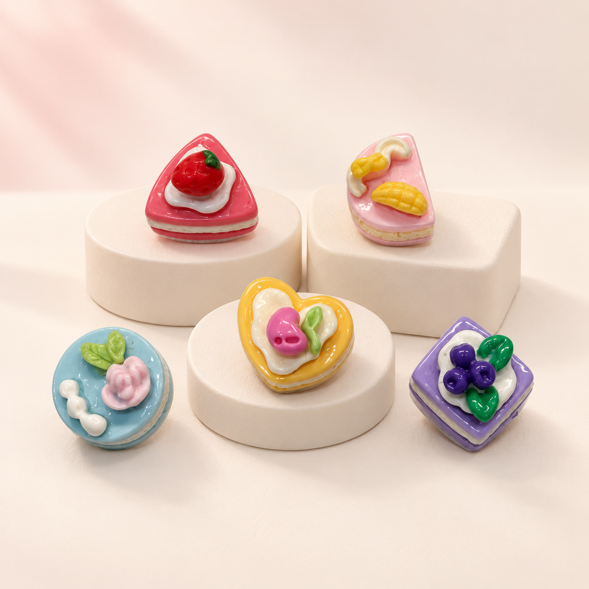 Sweet treat dog collar charms featuring colorful cake, macaron and fruit dessert designs