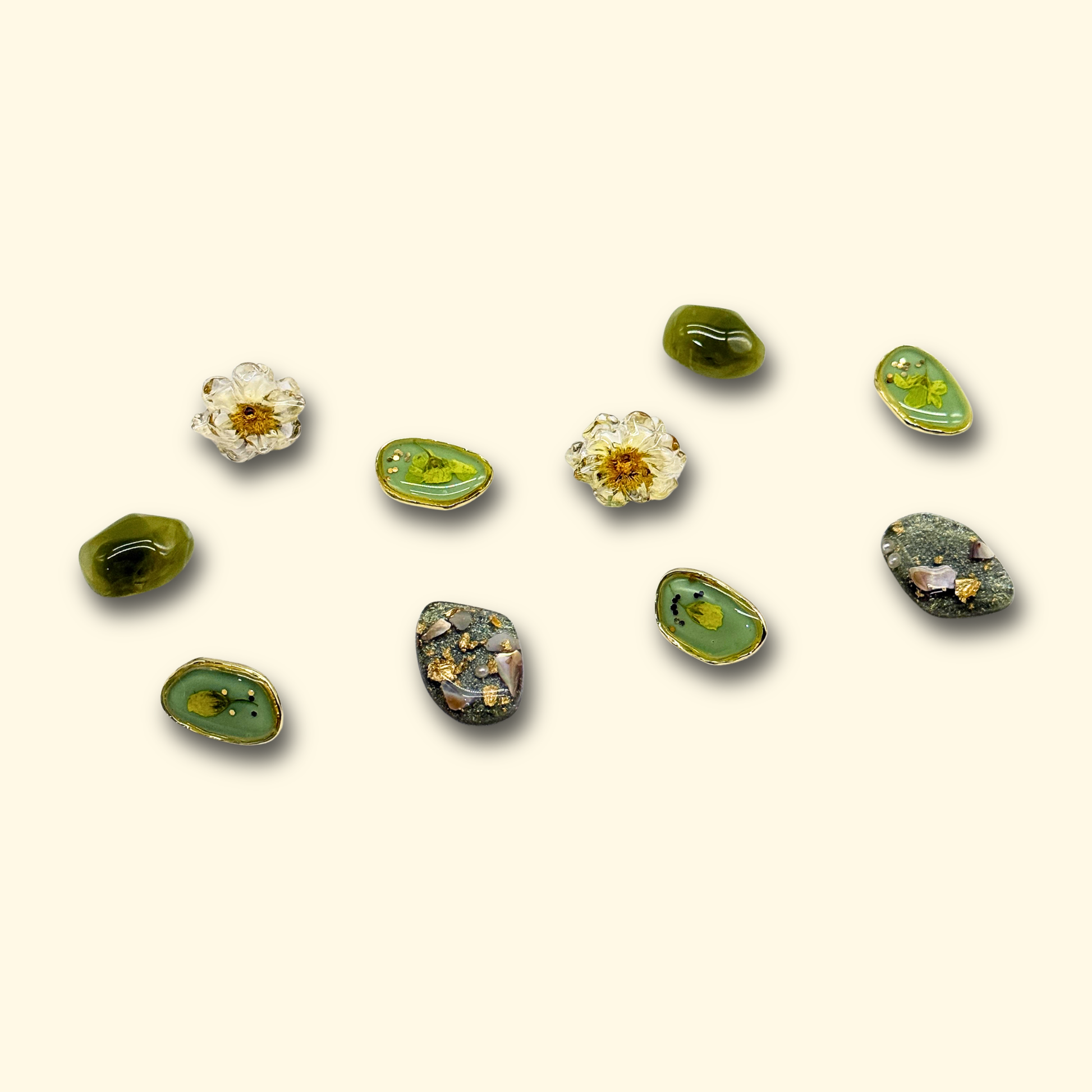A collection of Vintage Floral Geometric Charms, showcasing different designs in green and floral themes for your pet's collar
