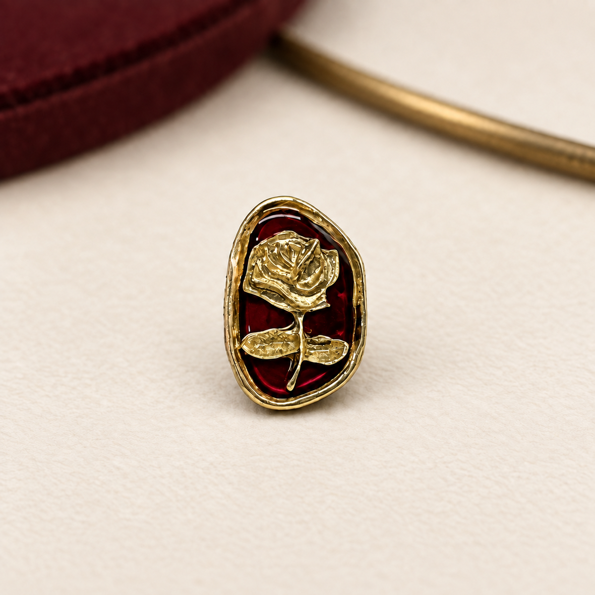 Vintage Rose dog collar charm with a gold-tone rose motif, deep red background and oval frame