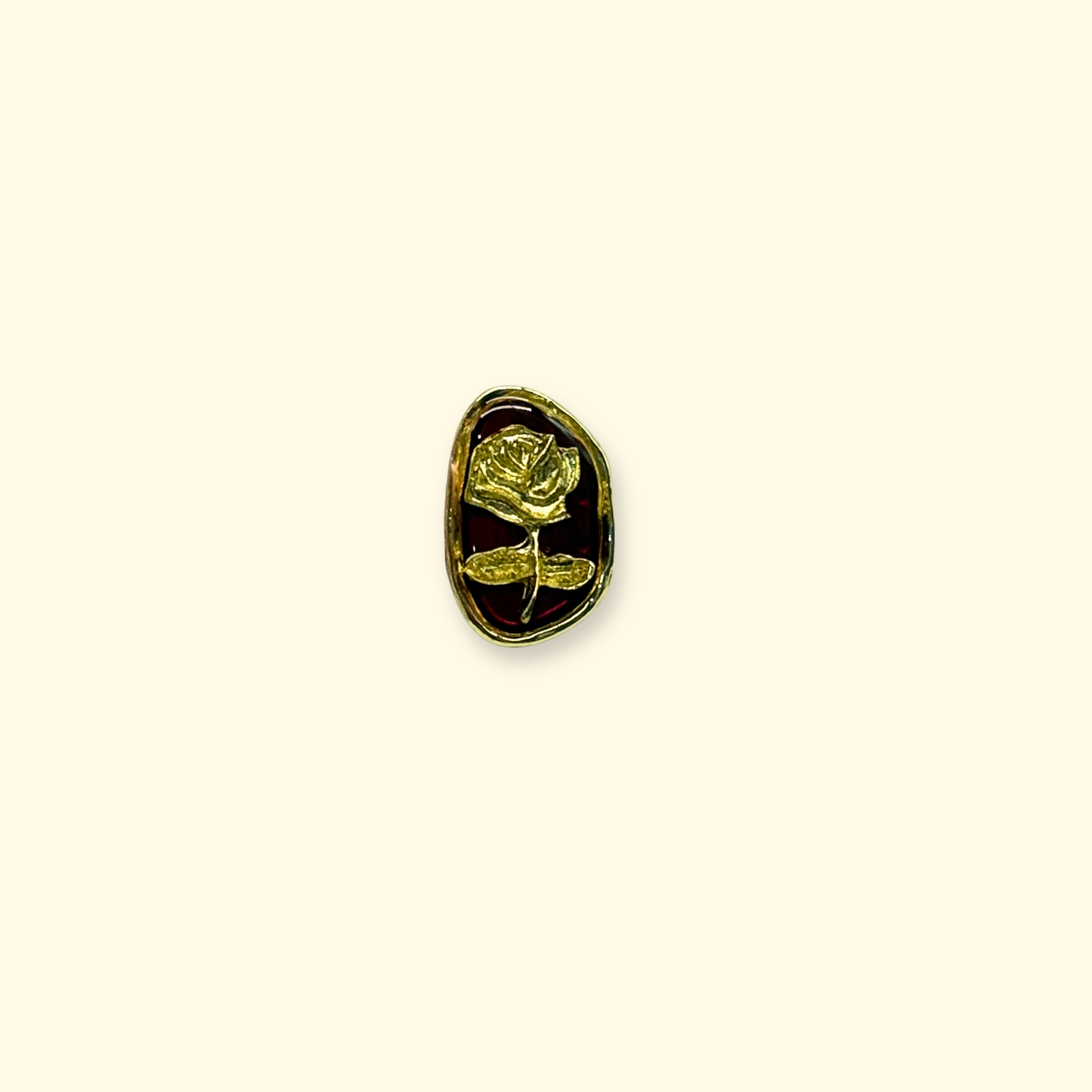 Close-up of a vintage rose enamel charm with gold detailing designed as a snap-on accessory for interchangeable dog collars and pet styling systems.