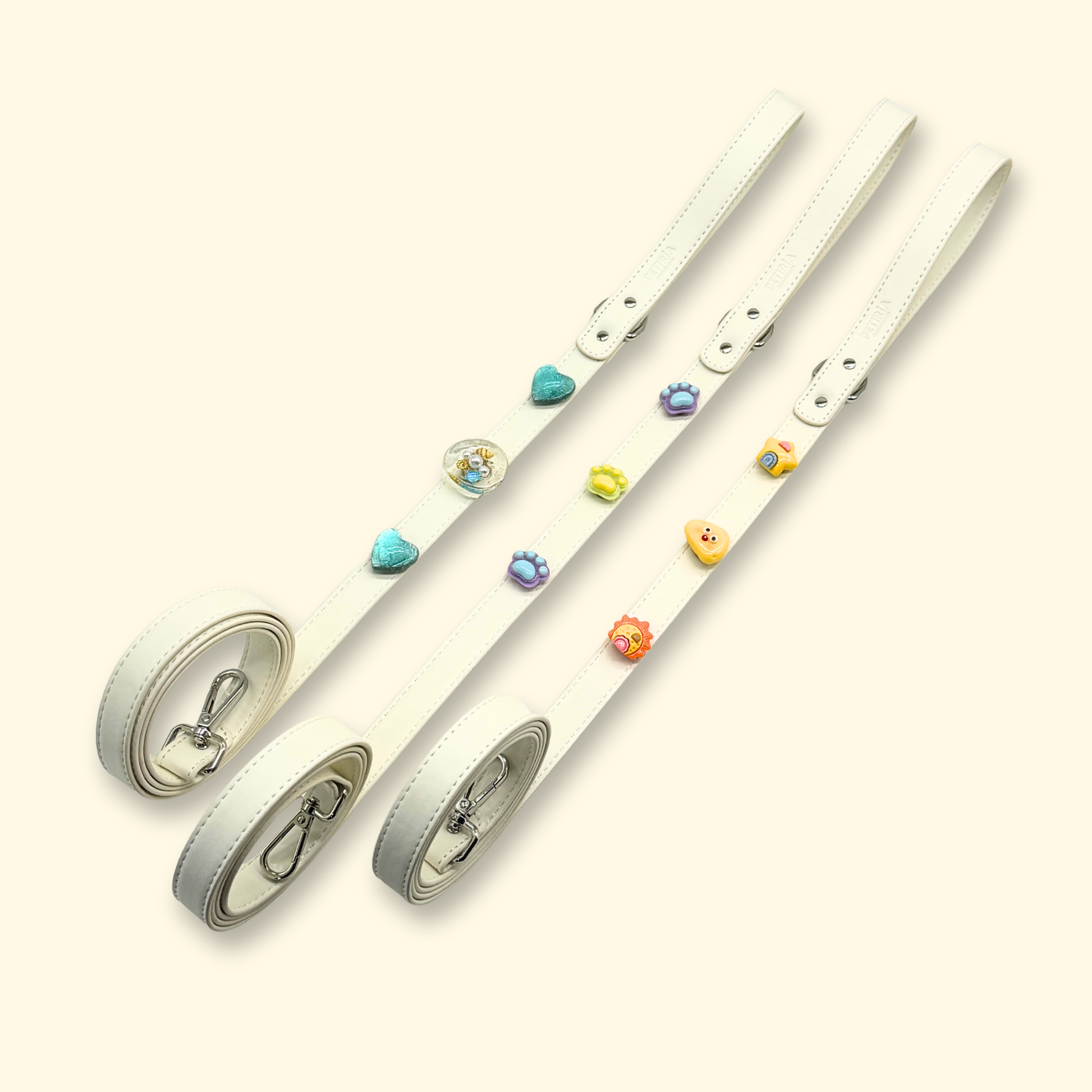 White dog leashes with interchangeable charms for stylish dogs and cats