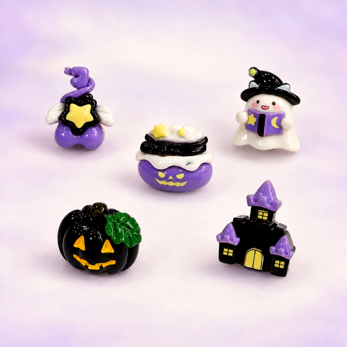 Witchy Halloween dog collar charms featuring a haunted house, ghost, magic cauldron, black jack-o-lantern and star design
