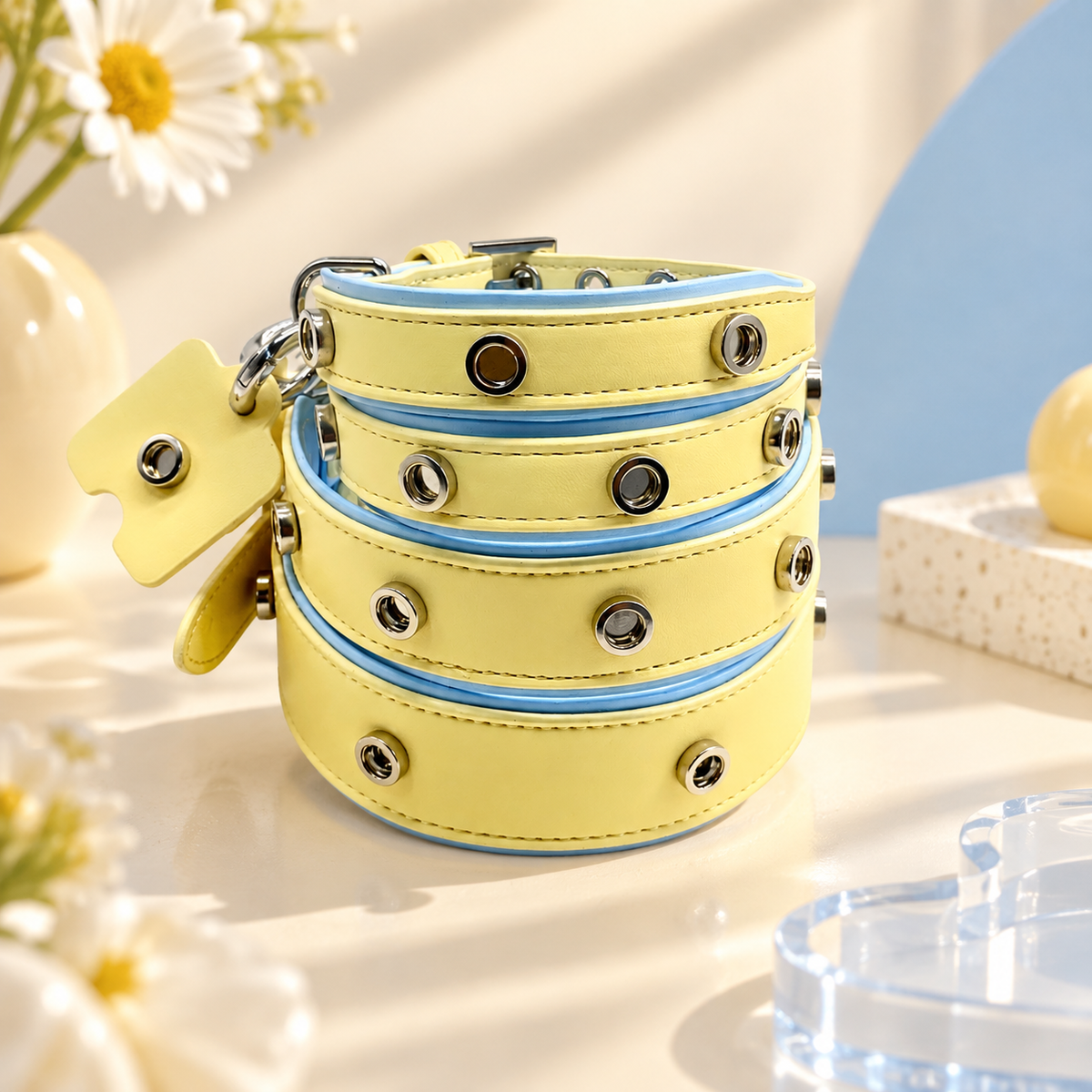 Yellow PETIRIA interchangeable dog collars in multiple sizes with snap-on charm attachment points