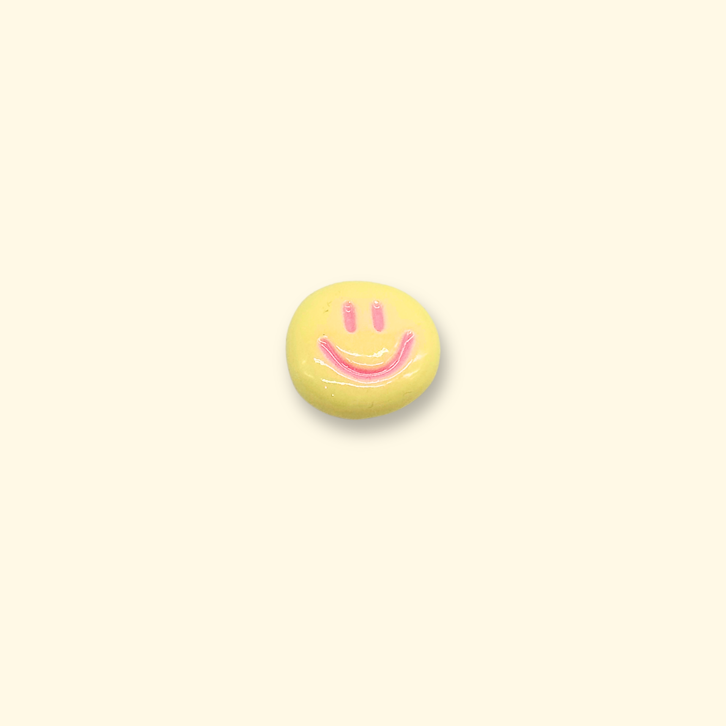 Yellow smiley face charm for pet collars, adding a cheerful and happy vibe to your pet's outfit