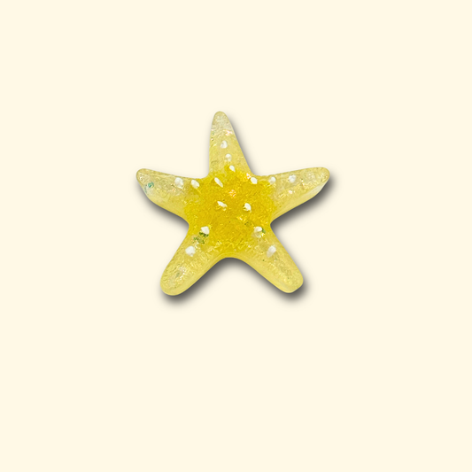 A vibrant yellow starfish charm with sparkling details, perfect for adding a playful and colorful touch to your pet's collar