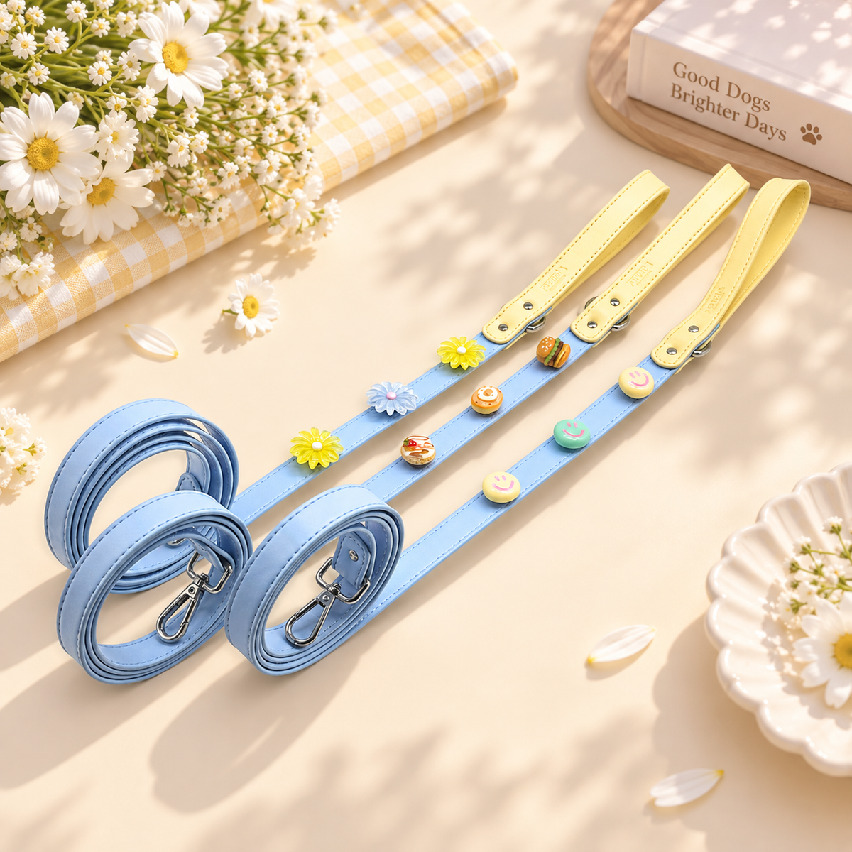 Yellow and blue PETIRIA dog leashes with interchangeable charms and coordinated hardware